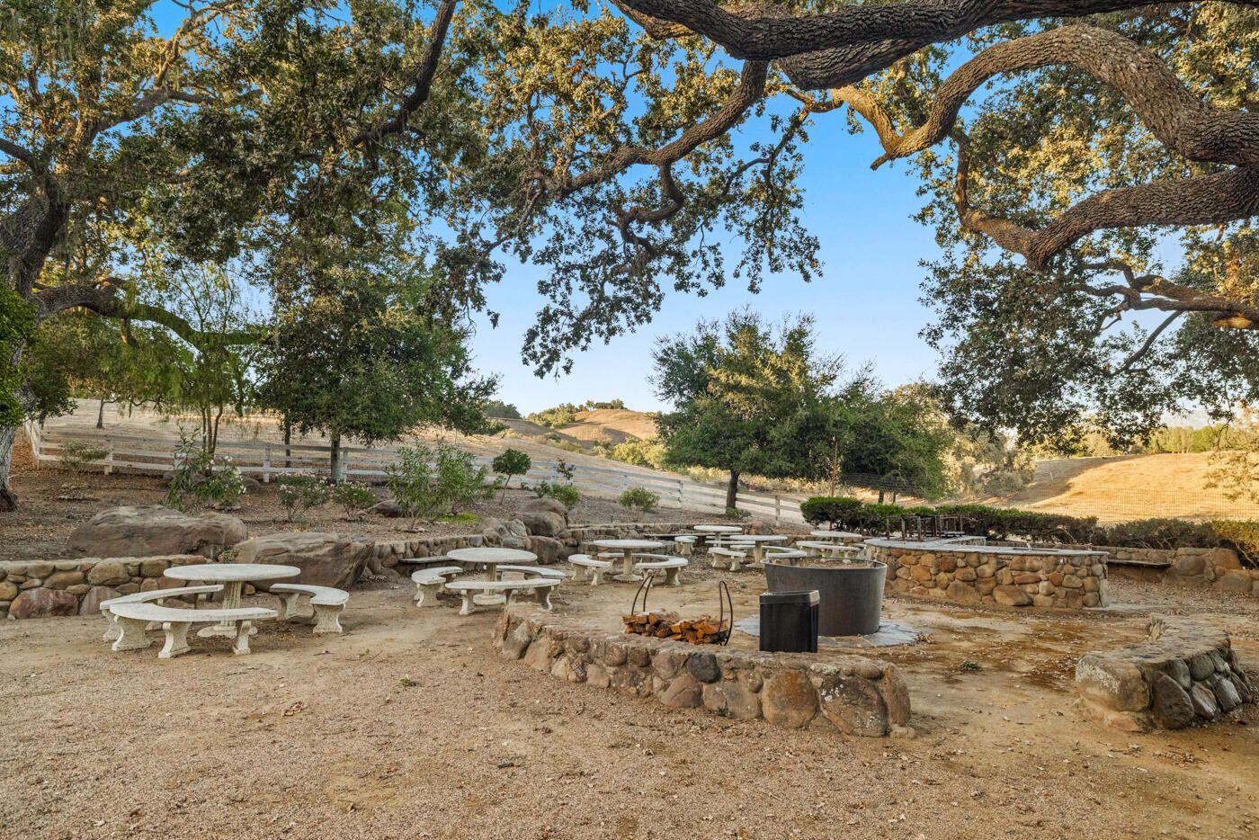 1750 Rambling Oaks Road Santa Ynez, CA 93460 - Photo 38 of 45 a view of a terrace with chairs and trees