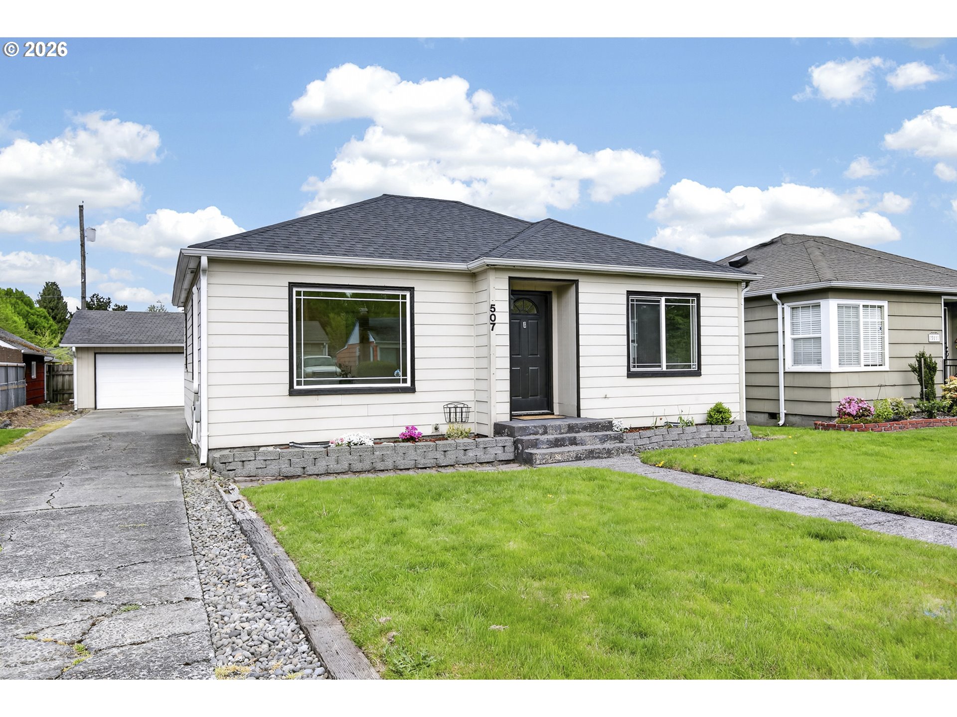 507 19th Avenue Longview, WA 98632 - Photo 1 of 17 a front view of a house with a porch