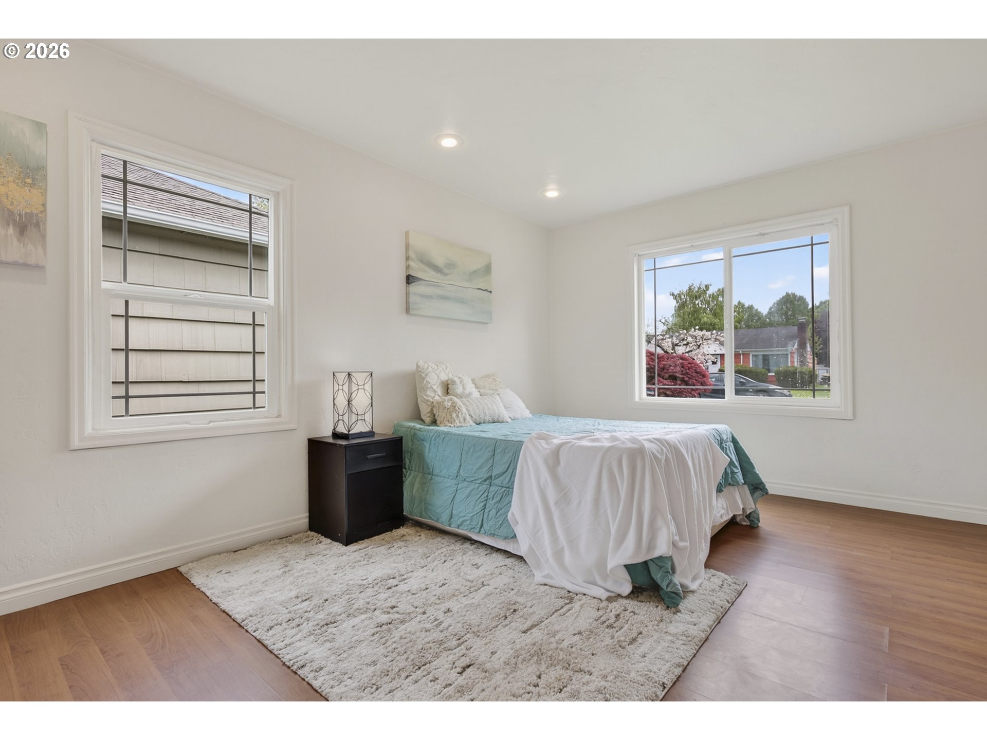 507 19th Avenue Longview, WA 98632 - Photo 11 of 17 a spacious bedroom with a large bed and a window