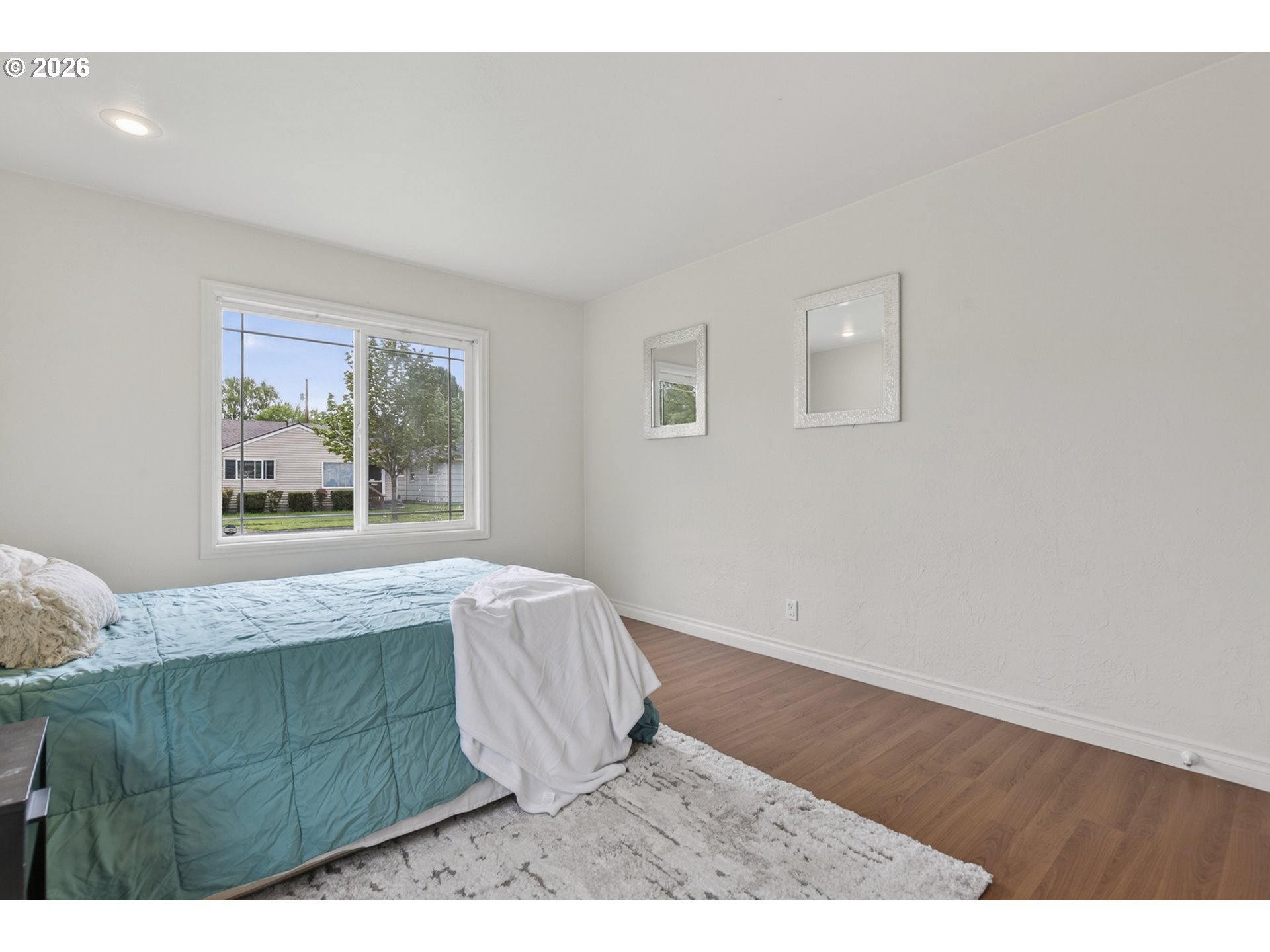 507 19th Avenue Longview, WA 98632 - Photo 12 of 17 a living room with a bed furniture and a window