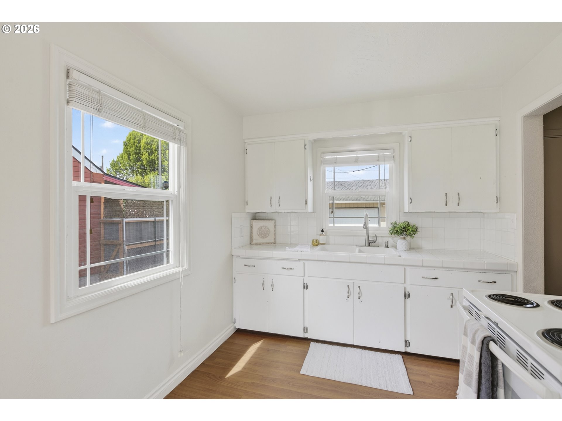 507 19th Avenue Longview, WA 98632 - Photo 7 of 17 a kitchen with a sink cabinets and window
