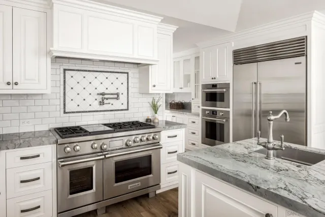 a bedroom with a bed table and window