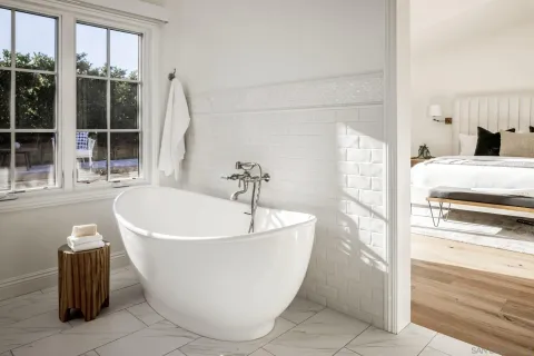a white bath tub sitting in a bathroom
