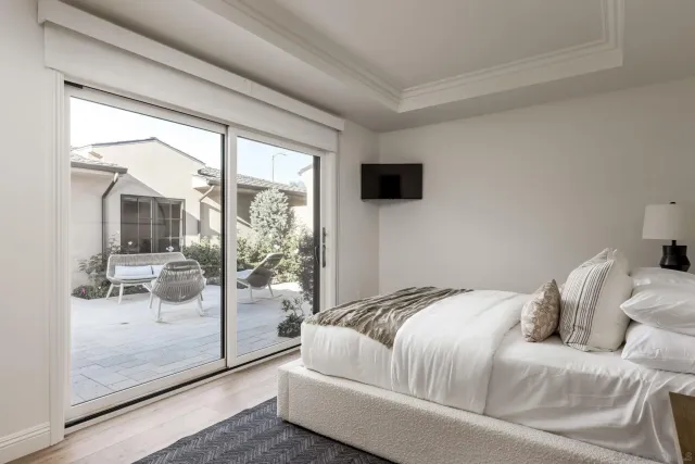an aerial view of a house with a garden and potted plants