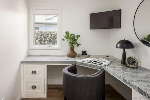 a kitchen with a sink a counter and cabinets