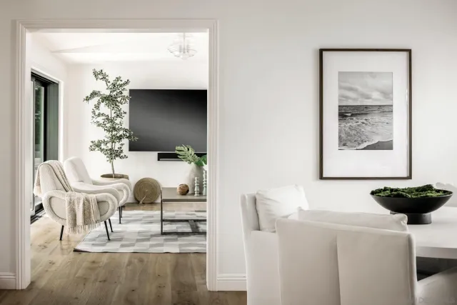 a kitchen with granite countertop a sink a stove and cabinets