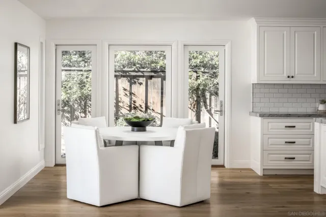 a view of a livingroom with furniture and a potted plant