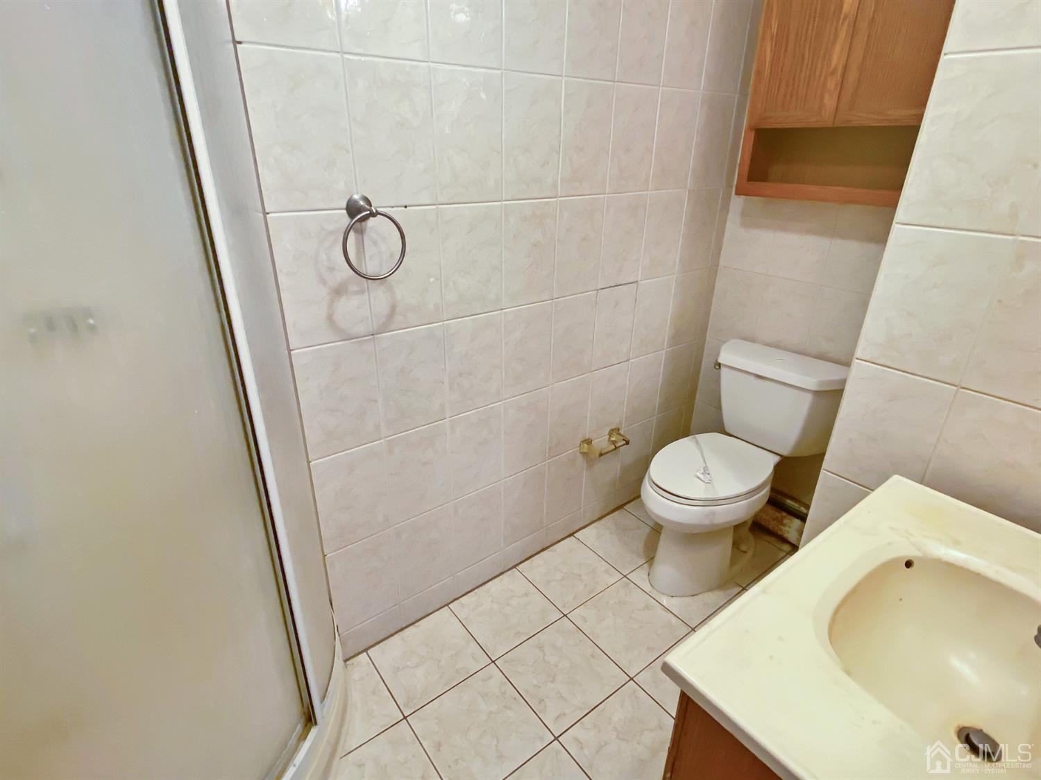 3181 Washington Road Sayreville, NJ 08859 - Photo 16 of 18 a bathroom with a sink and toilet
