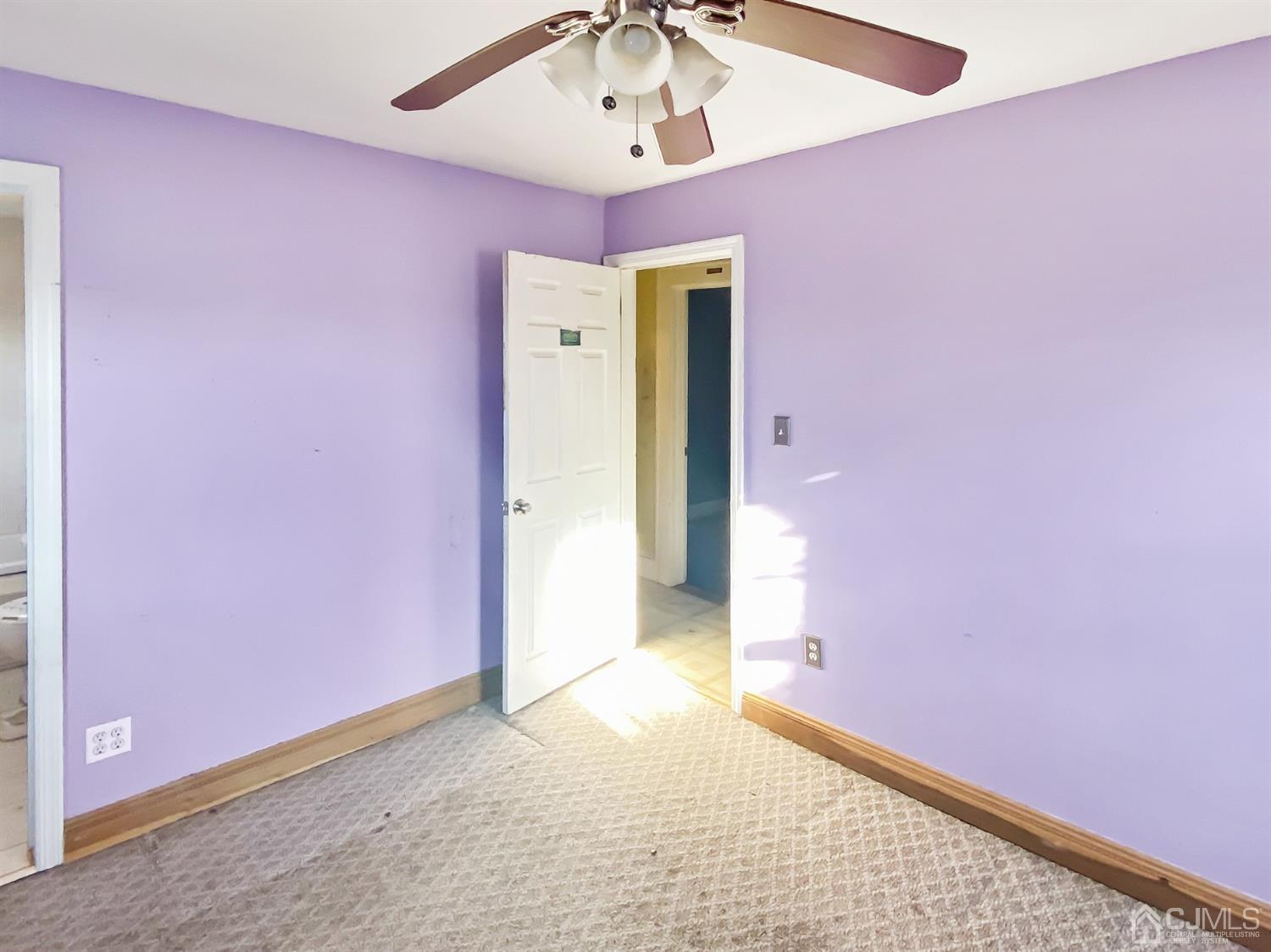 3181 Washington Road Sayreville, NJ 08859 - Photo 10 of 18 a view of a hallway with pink carpet