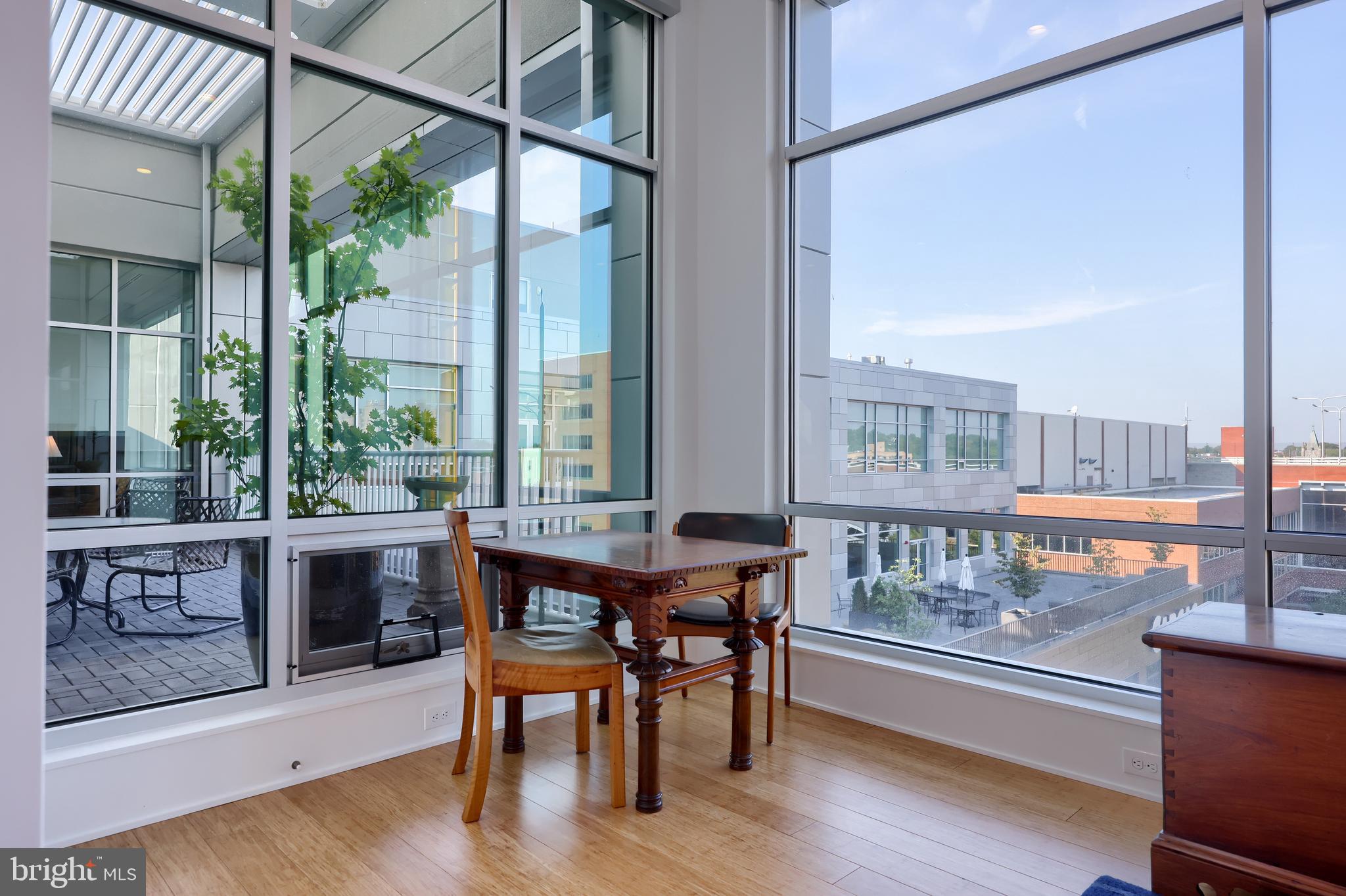 101 North Queen Street, Unit 404 Lancaster, PA 17603 - Photo 17 of 30 a dining room with furniture window wooden floor