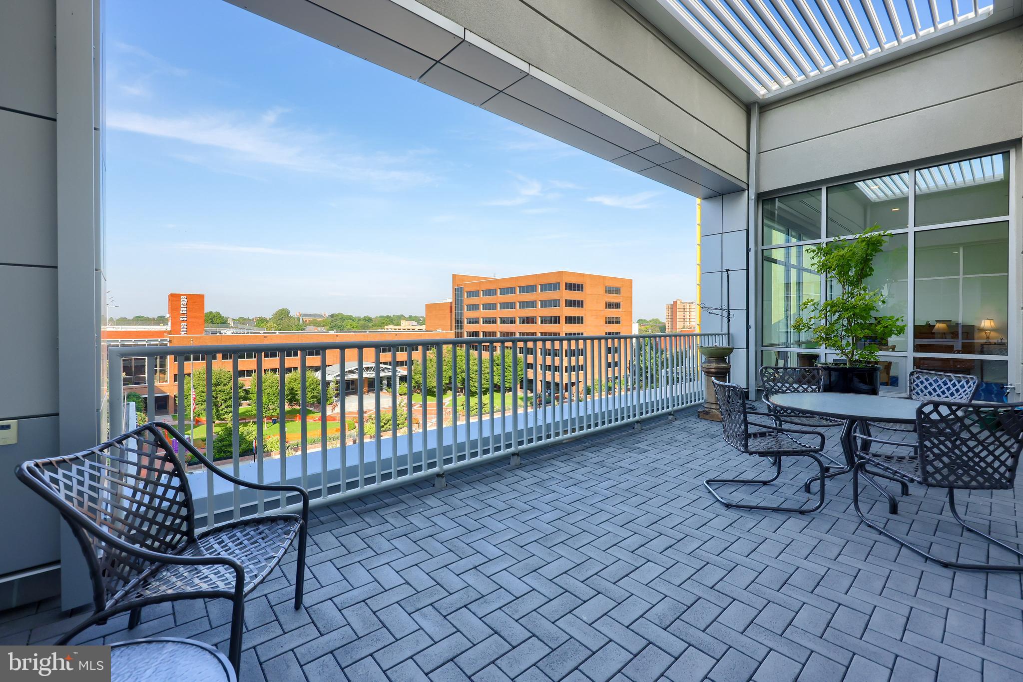 101 North Queen Street, Unit 404 Lancaster, PA 17603 - Photo 2 of 30 a view of a chairs and table in patio with potted plants