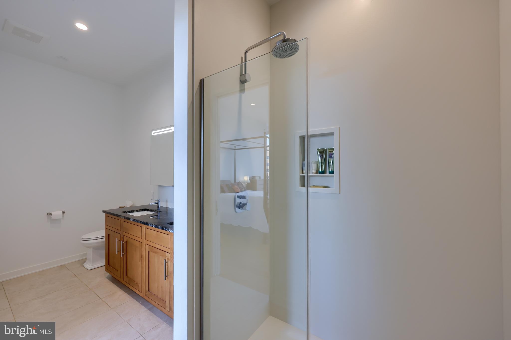 101 North Queen Street, Unit 404 Lancaster, PA 17603 - Photo 22 of 30 a bathroom with a double vanity sink and a mirror