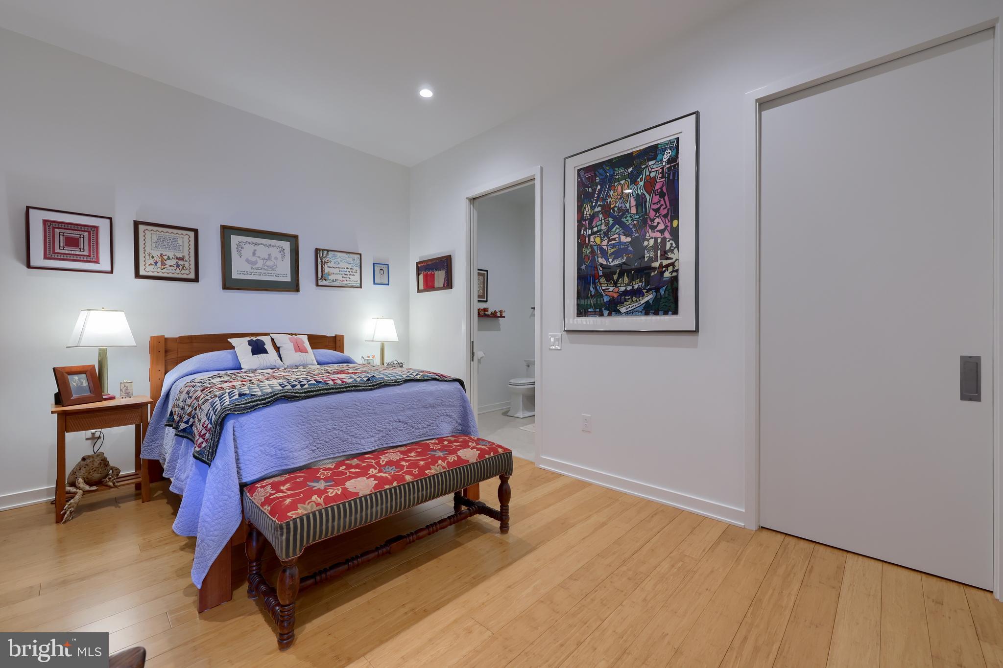 101 North Queen Street, Unit 404 Lancaster, PA 17603 - Photo 23 of 30 a bedroom with a bed and a wall painting