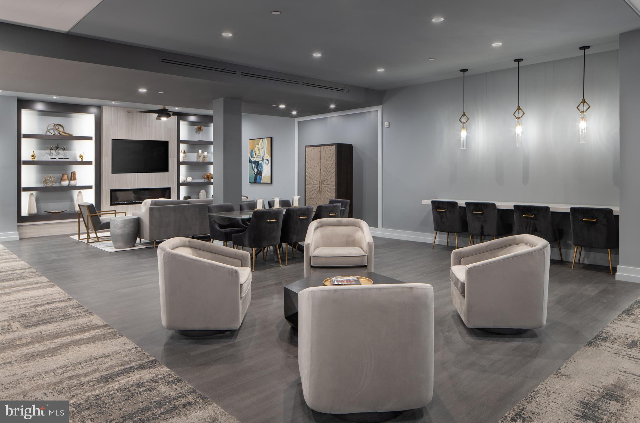 101 North Queen Street, Unit 404 Lancaster, PA 17603 - Photo 26 of 30 a living room with furniture and a flat screen tv