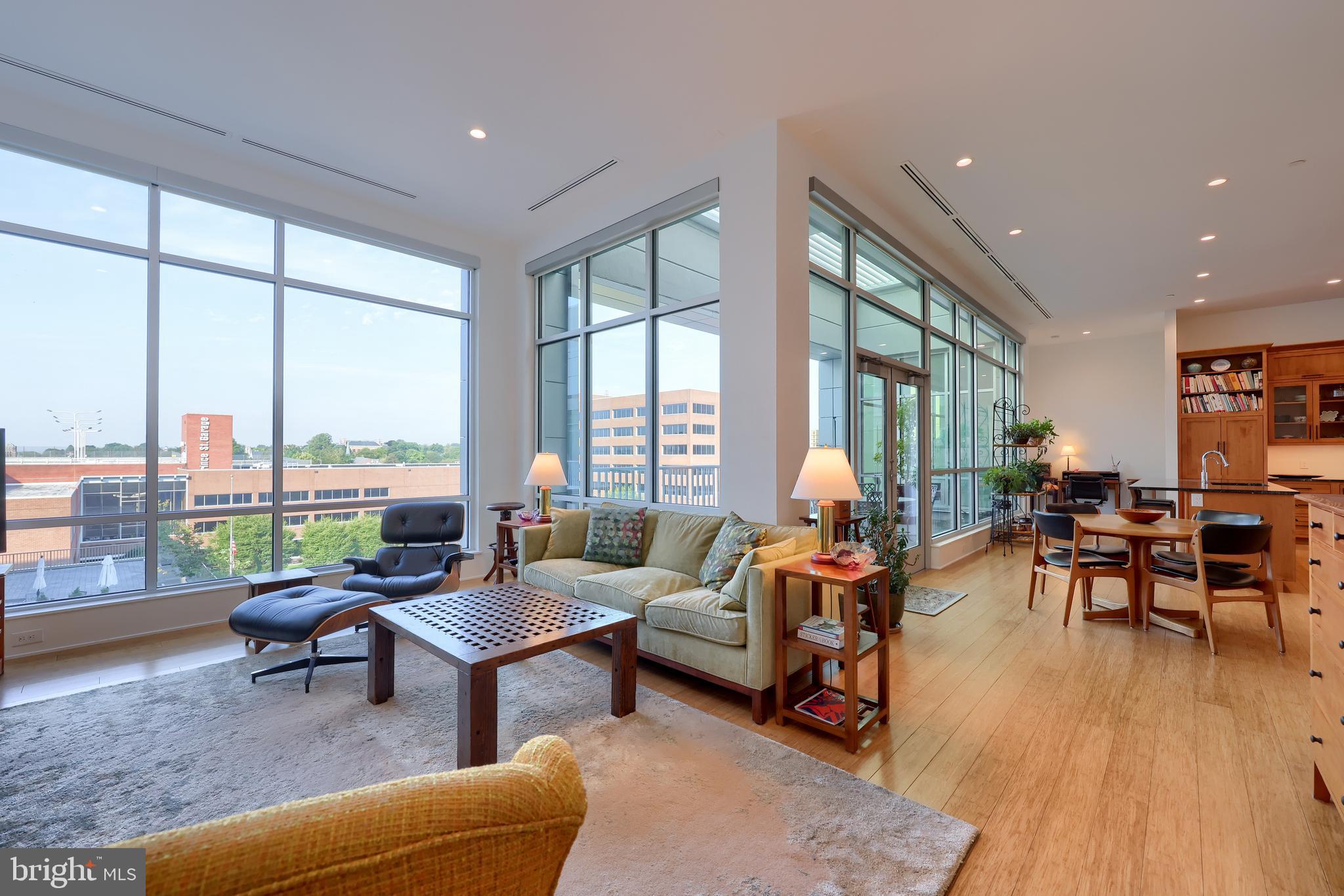 101 North Queen Street, Unit 404 Lancaster, PA 17603 - Photo 6 of 30 a living room with furniture and floor to ceiling windows
