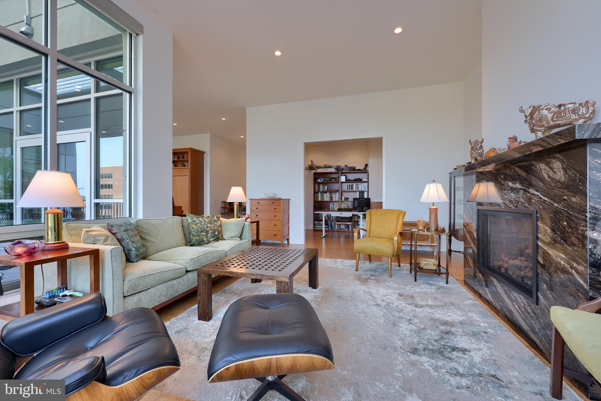 101 North Queen Street, Unit 404 Lancaster, PA 17603 - Photo 9 of 30 a living room with furniture and a flat screen tv