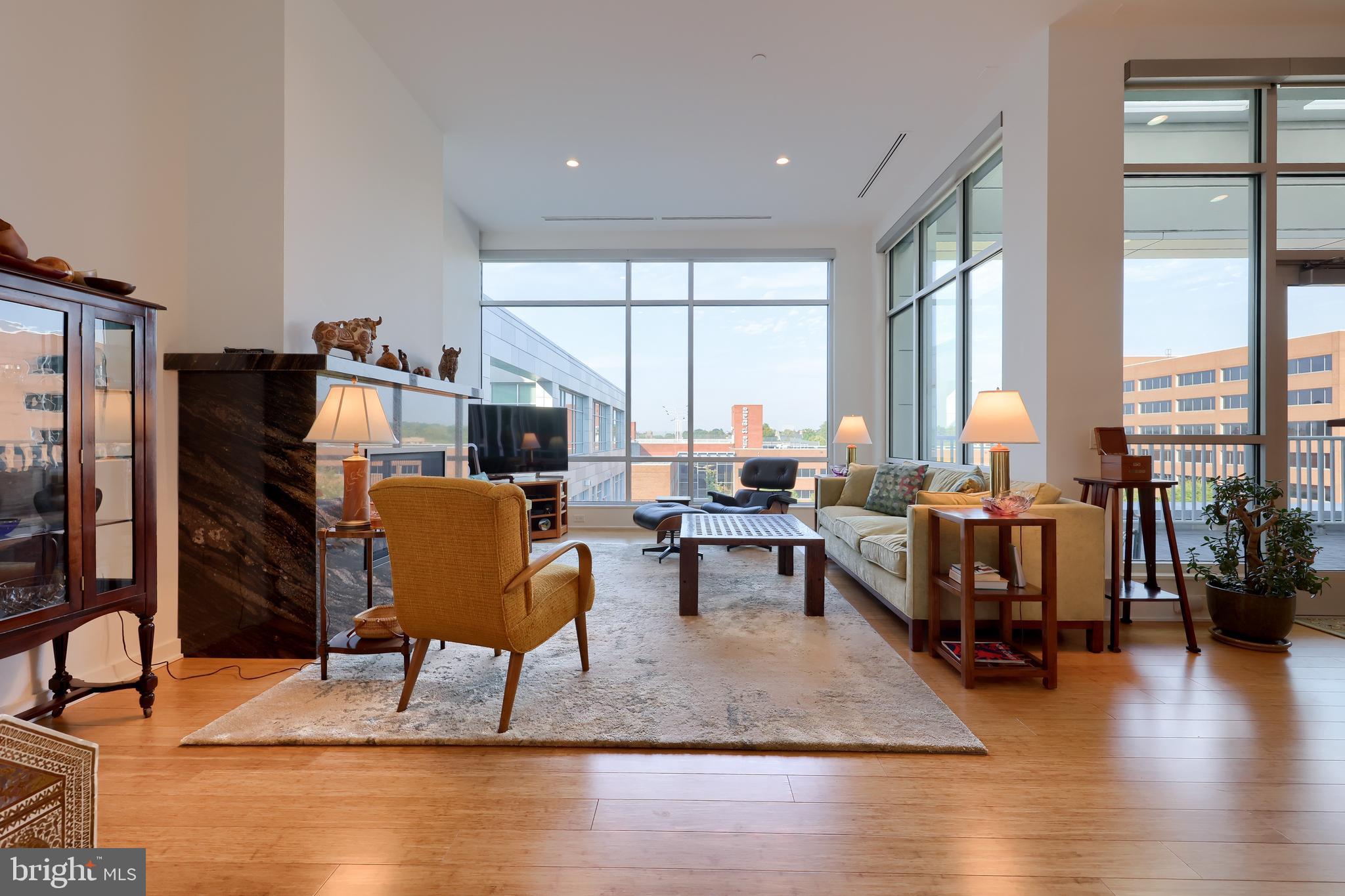 101 North Queen Street, Unit 404 Lancaster, PA 17603 - Photo 10 of 30 a living room with fireplace furniture and a large window