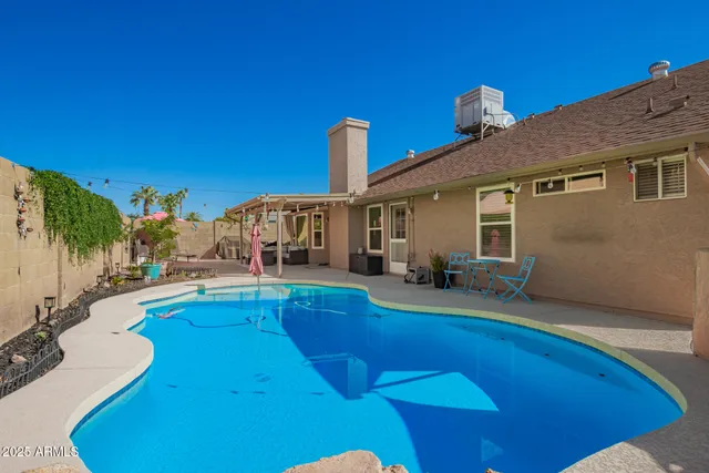 a view of a house with swimming pool
