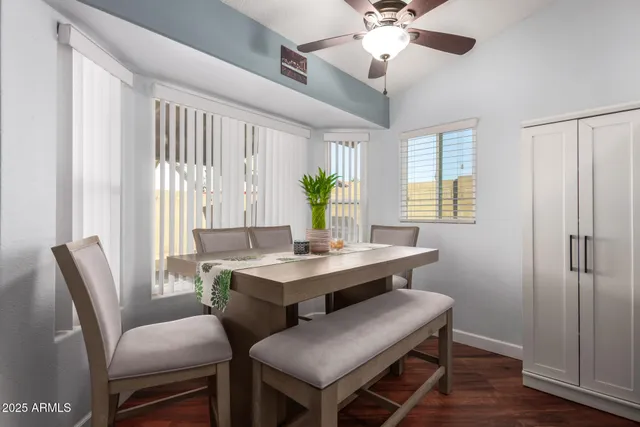 a view of a dining room with furniture window and wooden floor