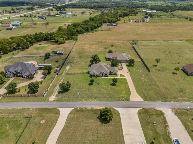 a view of a swimming pool with a yard