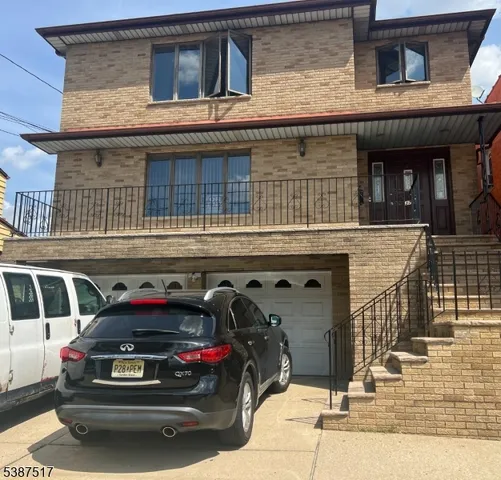 a view of a car parked front of a building