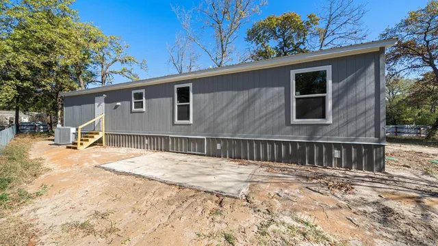 a view of a house with a snow in the yard