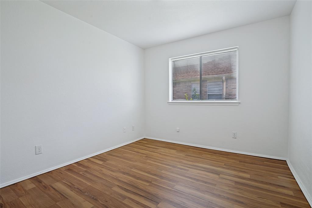 3111 Creekside Drive Sachse, TX 75048 - Photo 18 of 25 Bright room featuring wood-finish flooring, white baseboards, a window with blinds, and light-toned walls