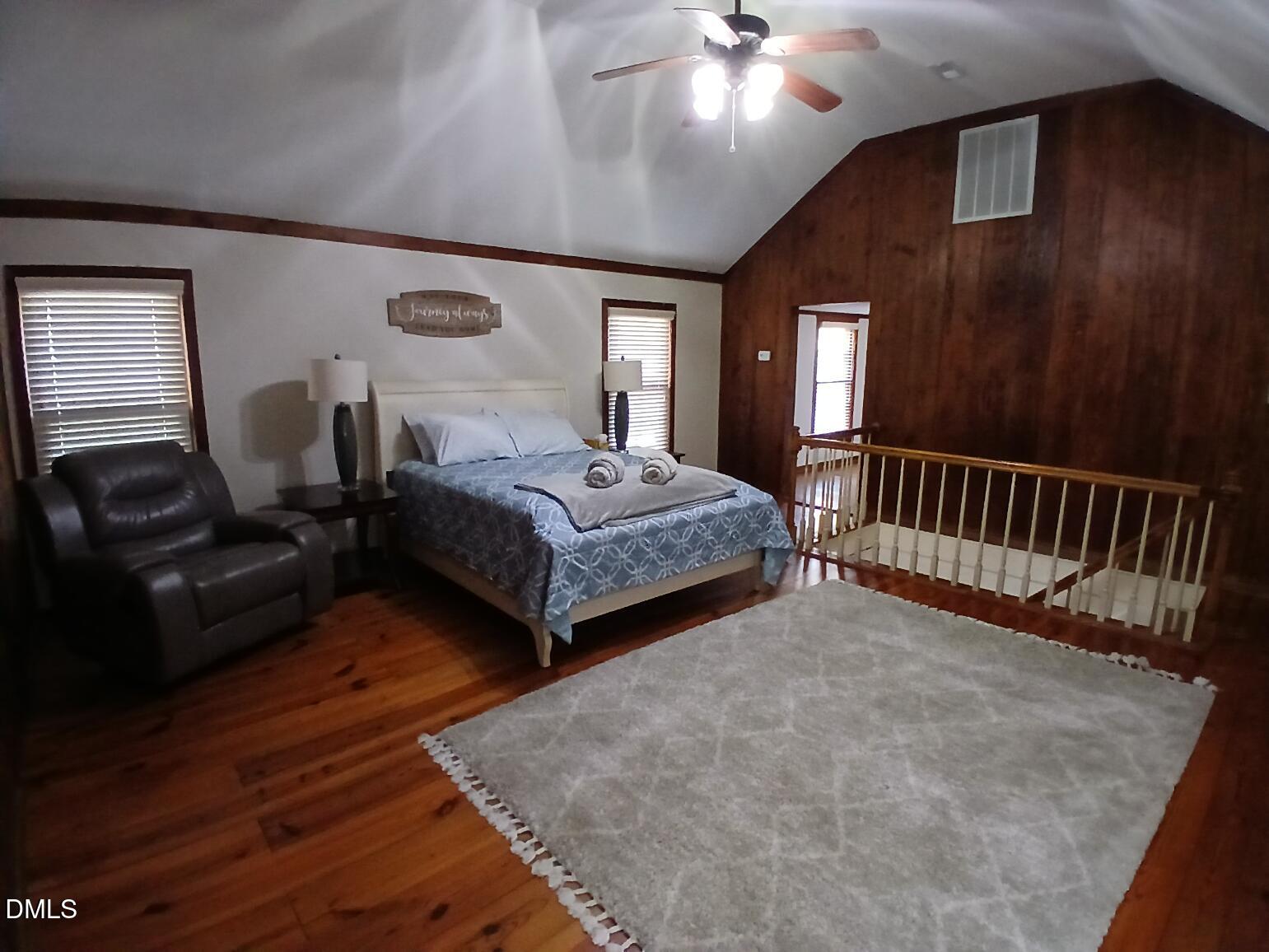 1920 Kelly Road Apex, NC 27502 - Photo 34 of 44 a bedroom with bed and balcony