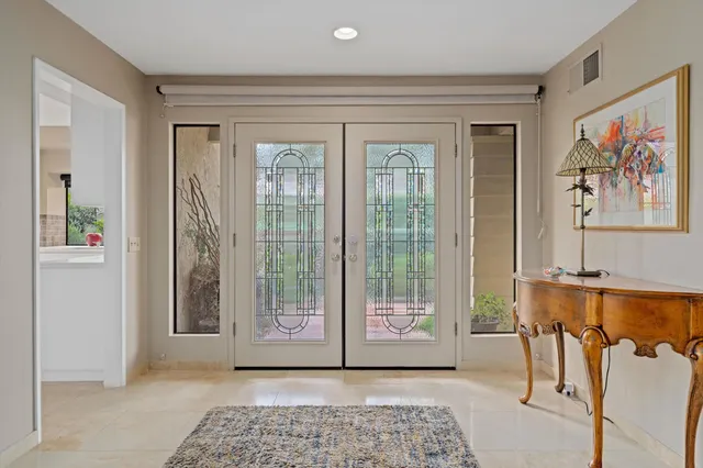 a view of a livingroom with furniture and windows