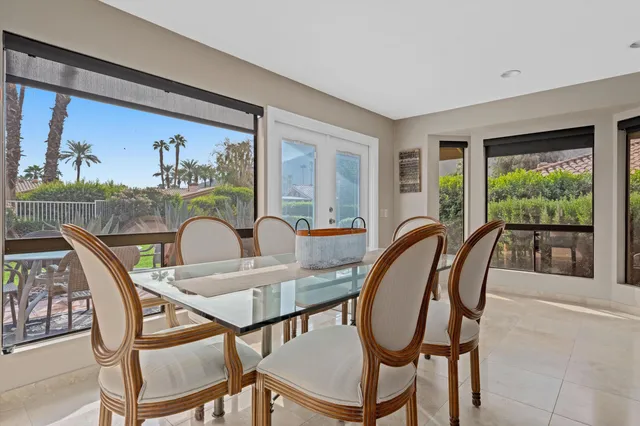 a dining room with furniture and window