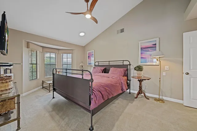 a bed room with a bed and a tv