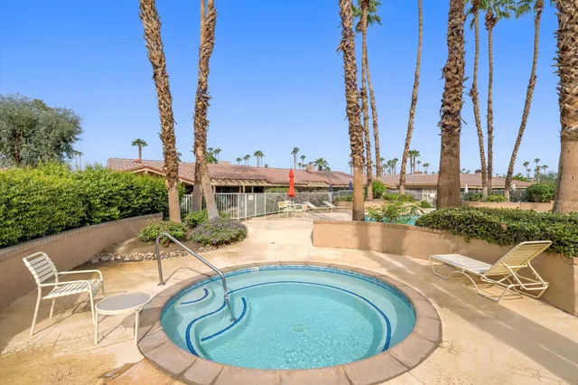 a view of swimming pool with outdoor seating
