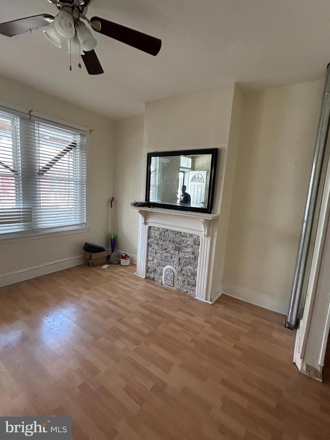 5622 Appletree Street Philadelphia, PA 19139 - Photo 2 of 10 an empty room with windows cabinet and fireplace