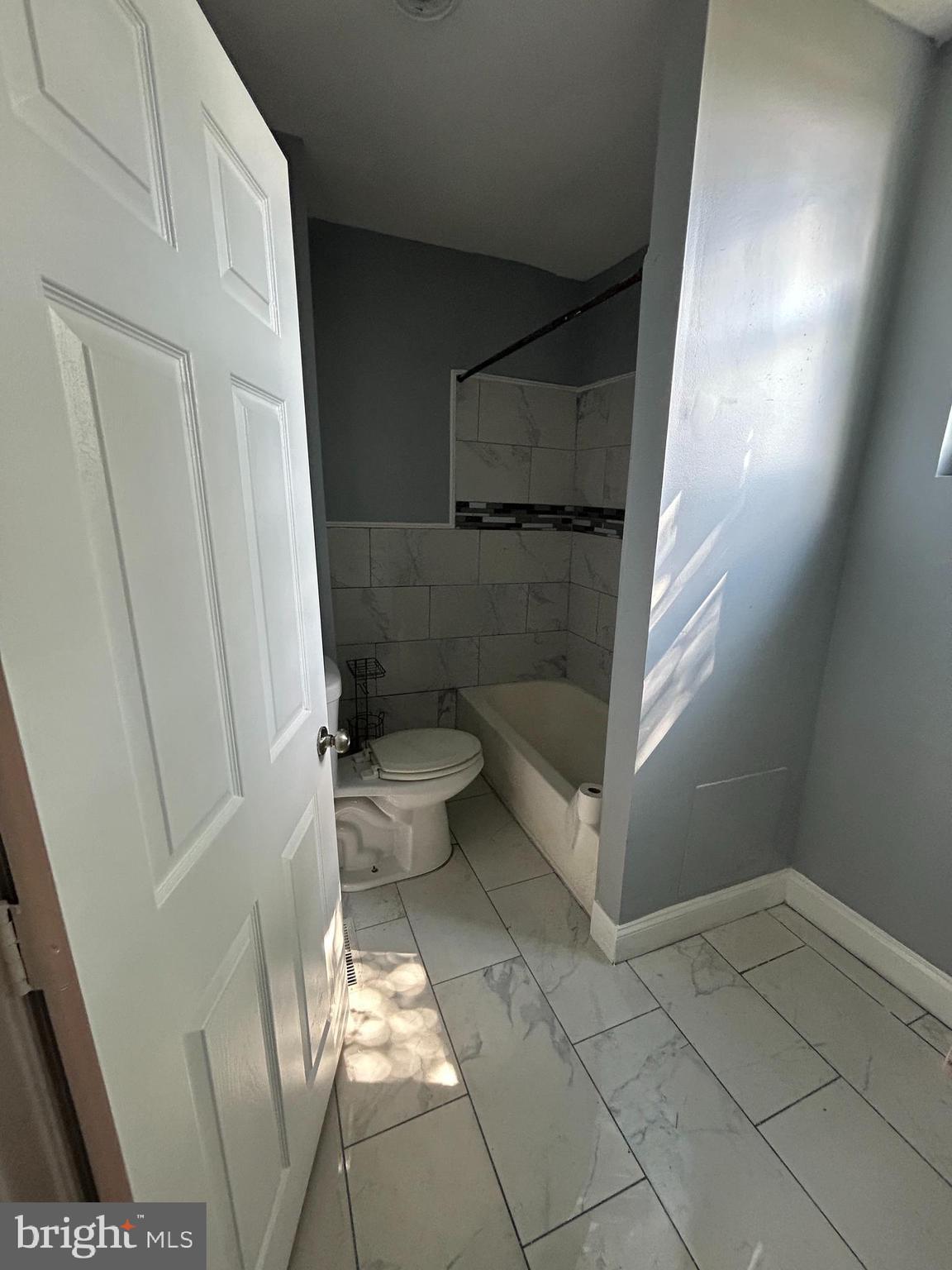 5622 Appletree Street Philadelphia, PA 19139 - Photo 9 of 10 a bathroom with a toilet and a shower