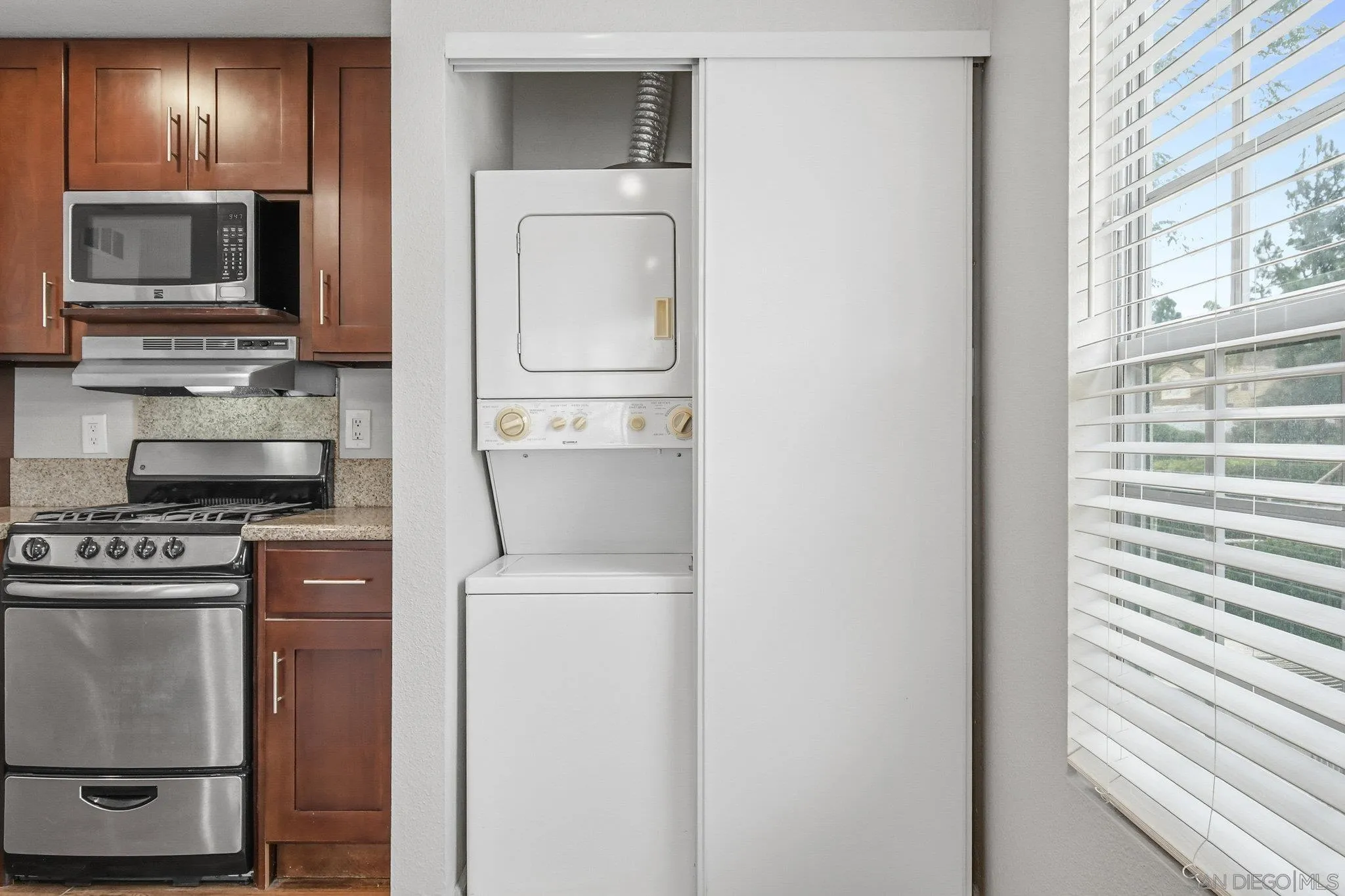 774 Eastshore Terrace, Unit 169 Chula Vista, CA 91913 - Photo 14 of 34 a kitchen with a refrigerator stove and microwave