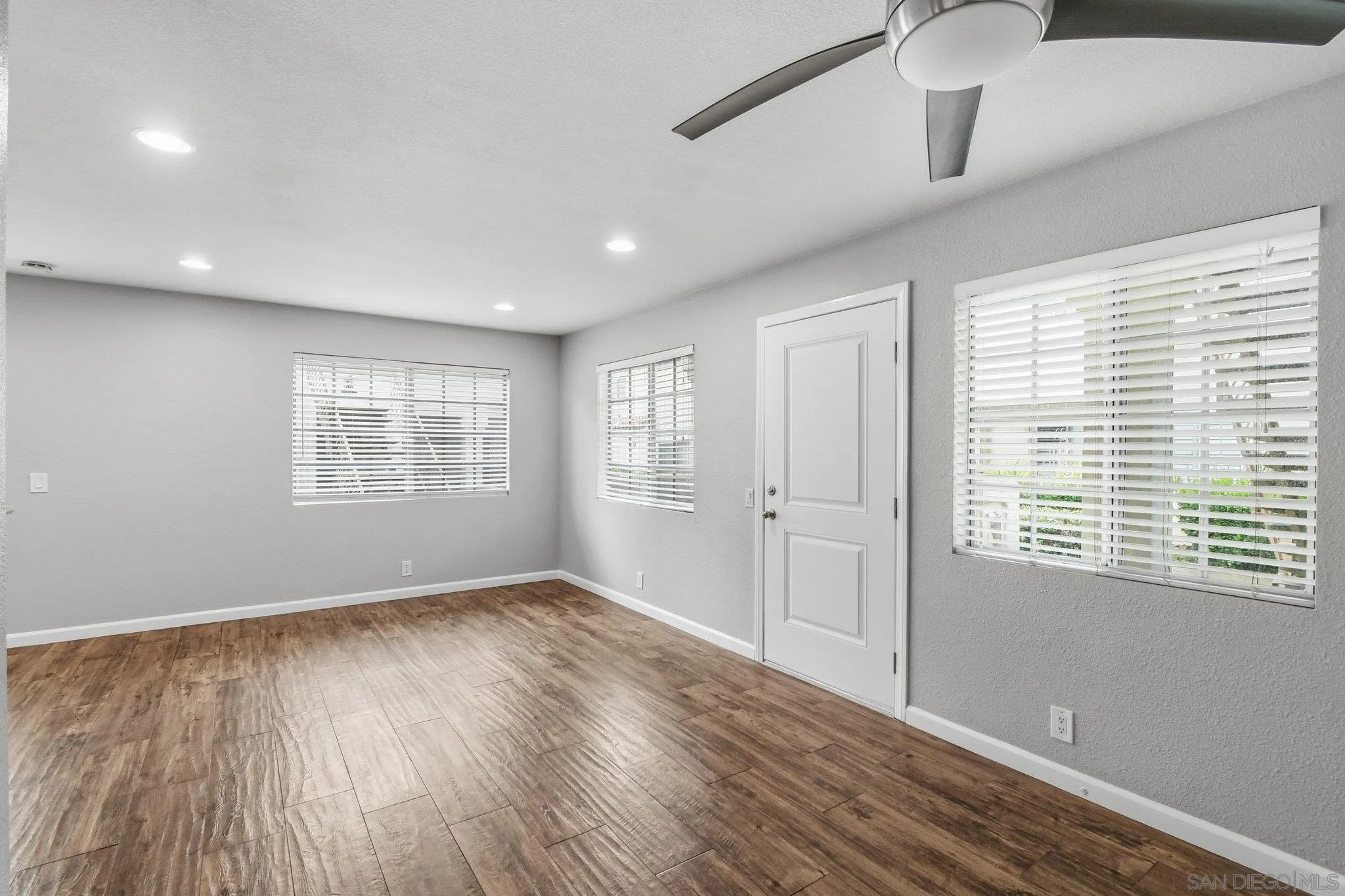 774 Eastshore Terrace, Unit 169 Chula Vista, CA 91913 - Photo 16 of 34 a view of an empty room with wooden floor and a window