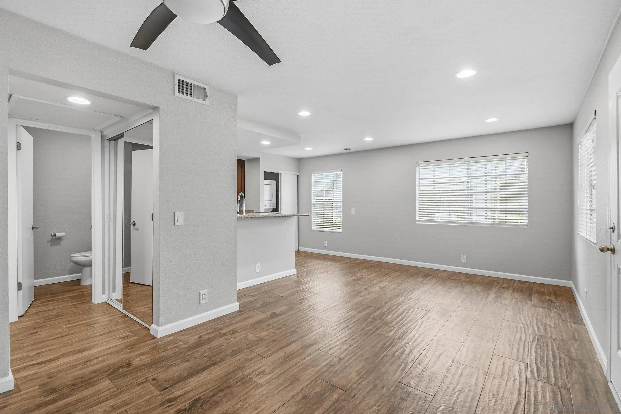 774 Eastshore Terrace, Unit 169 Chula Vista, CA 91913 - Photo 17 of 34 a view of an empty room with wooden floor and a window