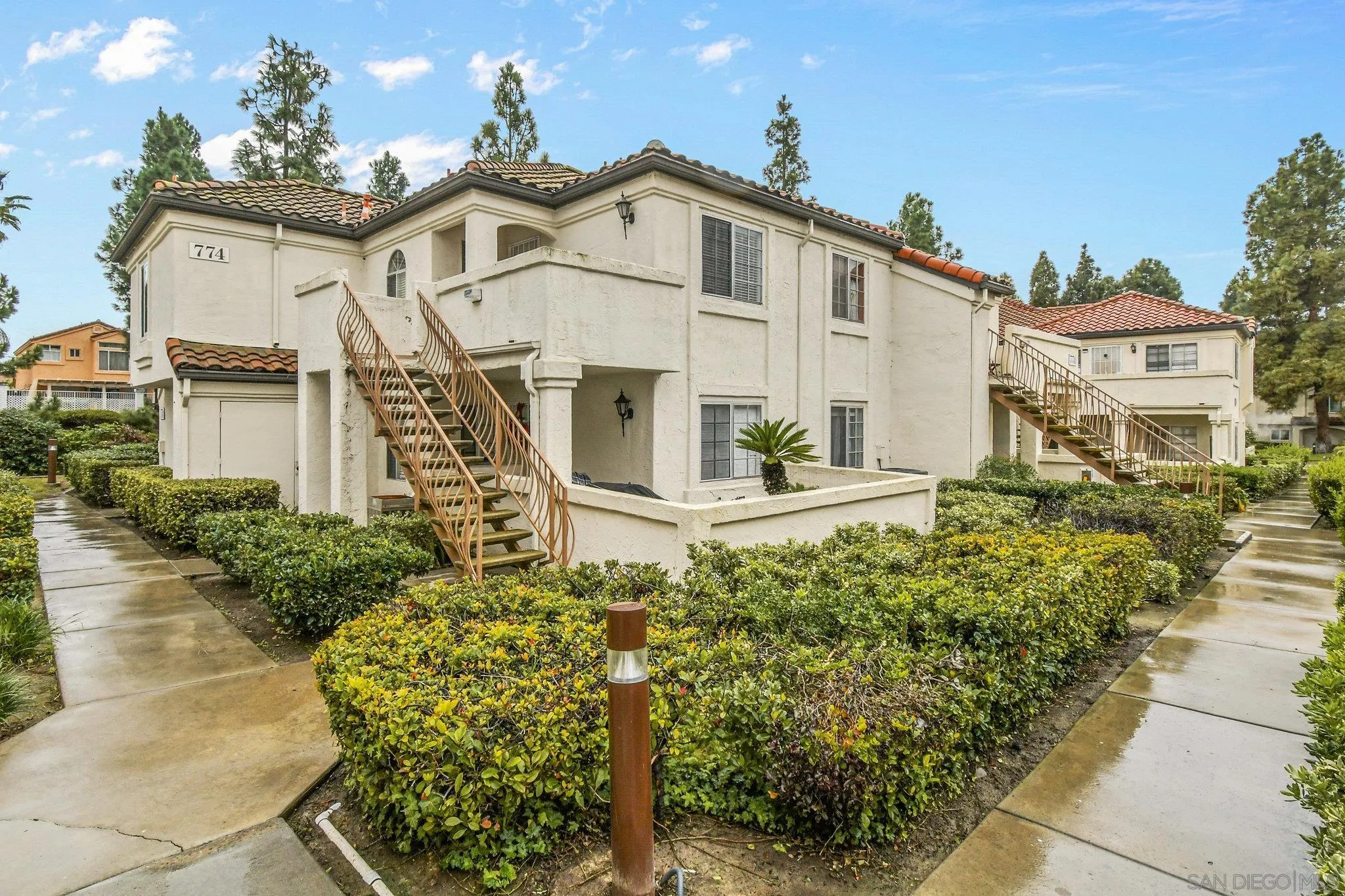 774 Eastshore Terrace, Unit 169 Chula Vista, CA 91913 - Photo 24 of 34 a front view of a house with a garden