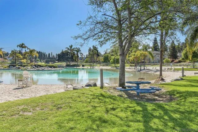 a view of a lake with houses in the back
