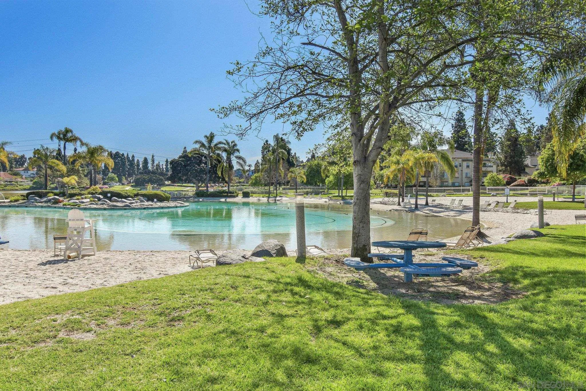 774 Eastshore Terrace, Unit 169 Chula Vista, CA 91913 - Photo 32 of 34 a view of a lake with houses in the back