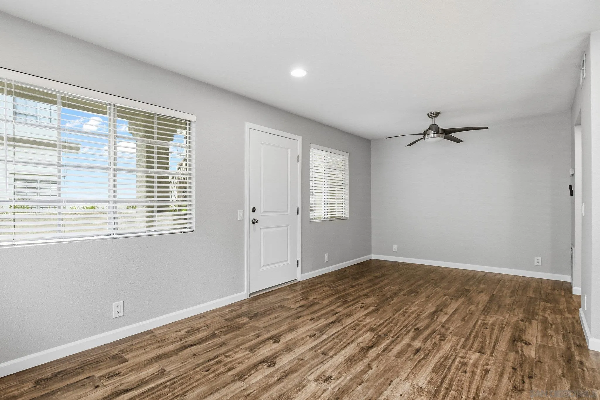 774 Eastshore Terrace, Unit 169 Chula Vista, CA 91913 - Photo 6 of 34 a view of an empty room with wooden floor and a window