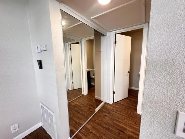 a view of a bedroom from a hallway