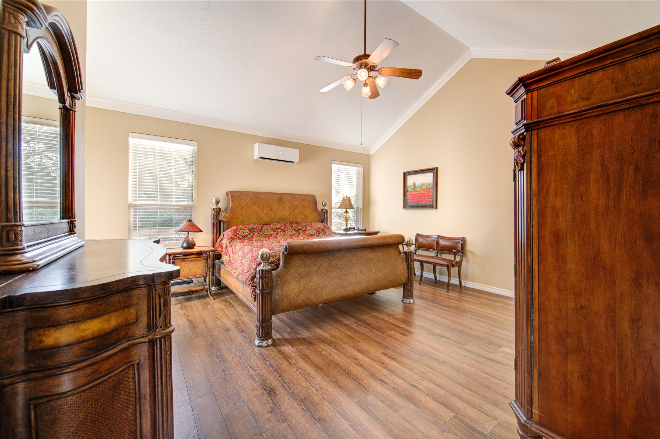 7207 Fiesta Flower Katy, TX 77494 - Photo 17 of 37 A spacious owner’s retreat tucked away for privacy, featuring double closets and tranquil views of the pool and backyard oasis.