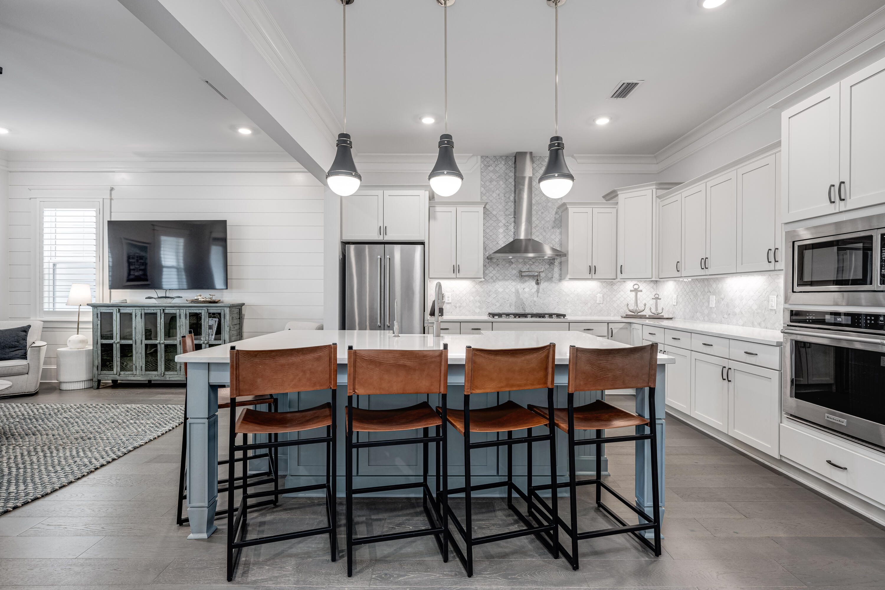 161 Siasconset Ln Inlet Beach Inlet Beach, FL 32461 - Photo 4 of 46 a kitchen with a dining table chairs and microwave