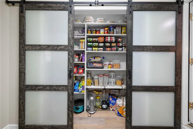 a large bedroom with a large bed and furniture