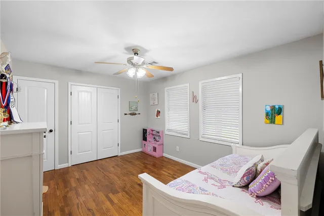 a bathroom with a granite countertop sink mirror and shower