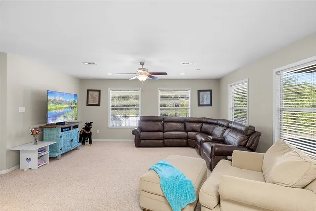 a kitchen with cabinets appliances and a refrigerator