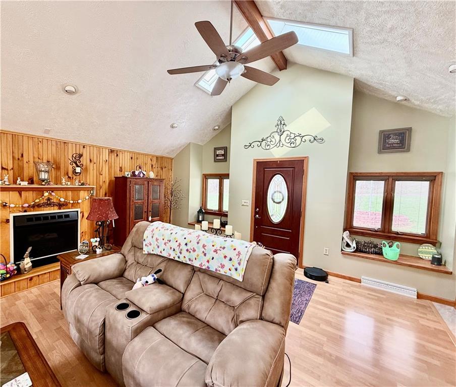 198 Leslie Road Valencia, PA 16059 - Photo 11 of 43 a living room with furniture a fireplace and a flat screen tv