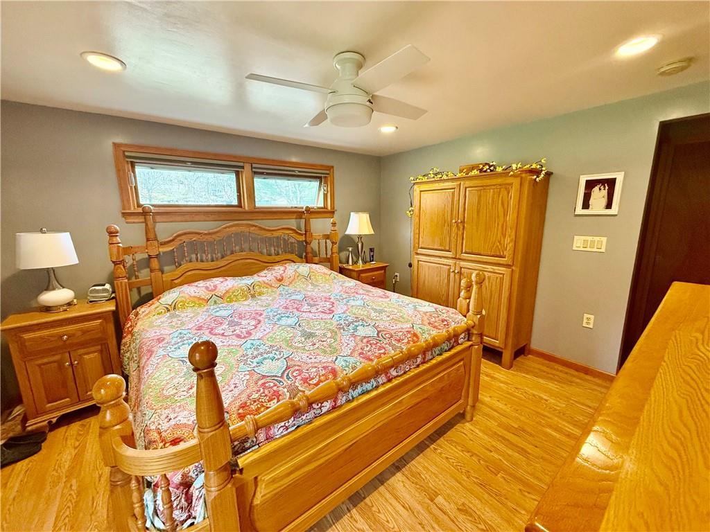 198 Leslie Road Valencia, PA 16059 - Photo 17 of 43 a bedroom with a bed and wooden floor