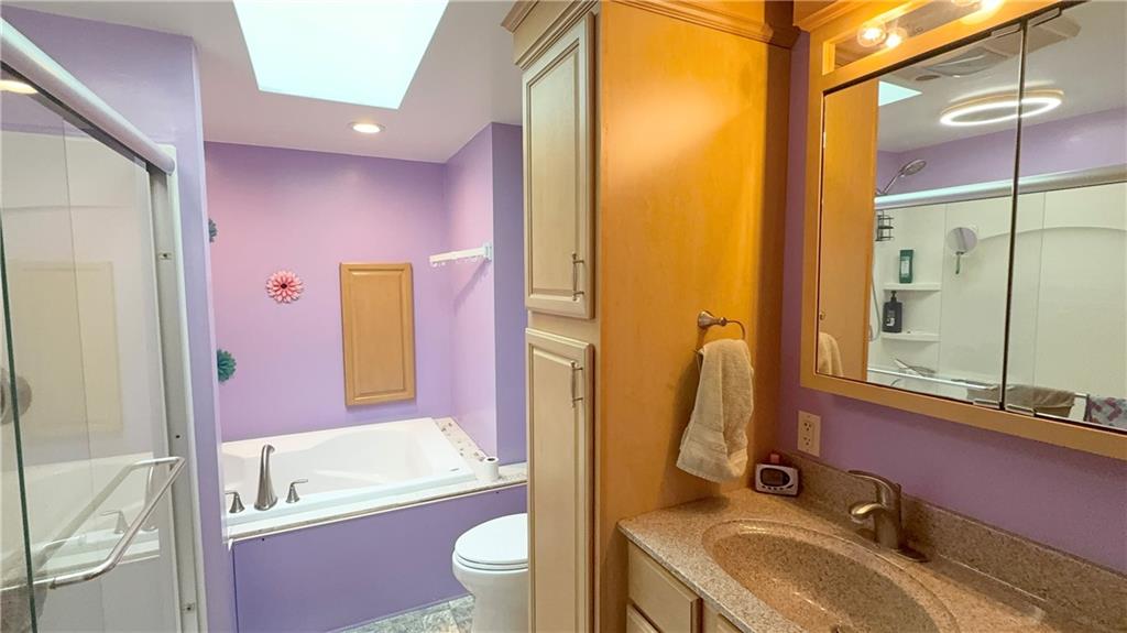 198 Leslie Road Valencia, PA 16059 - Photo 22 of 43 a bathroom with a granite countertop sink toilet tub and shower